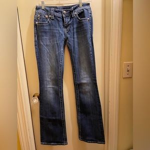 Miss Me signature boot cut women’s jeans.